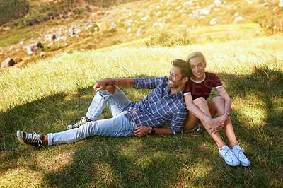 Buy stock photo Shot of an affectionate young couple enjoying a day outdoors