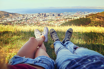 Buy stock photo Shot of an affectionate young couple enjoying a day outdoors