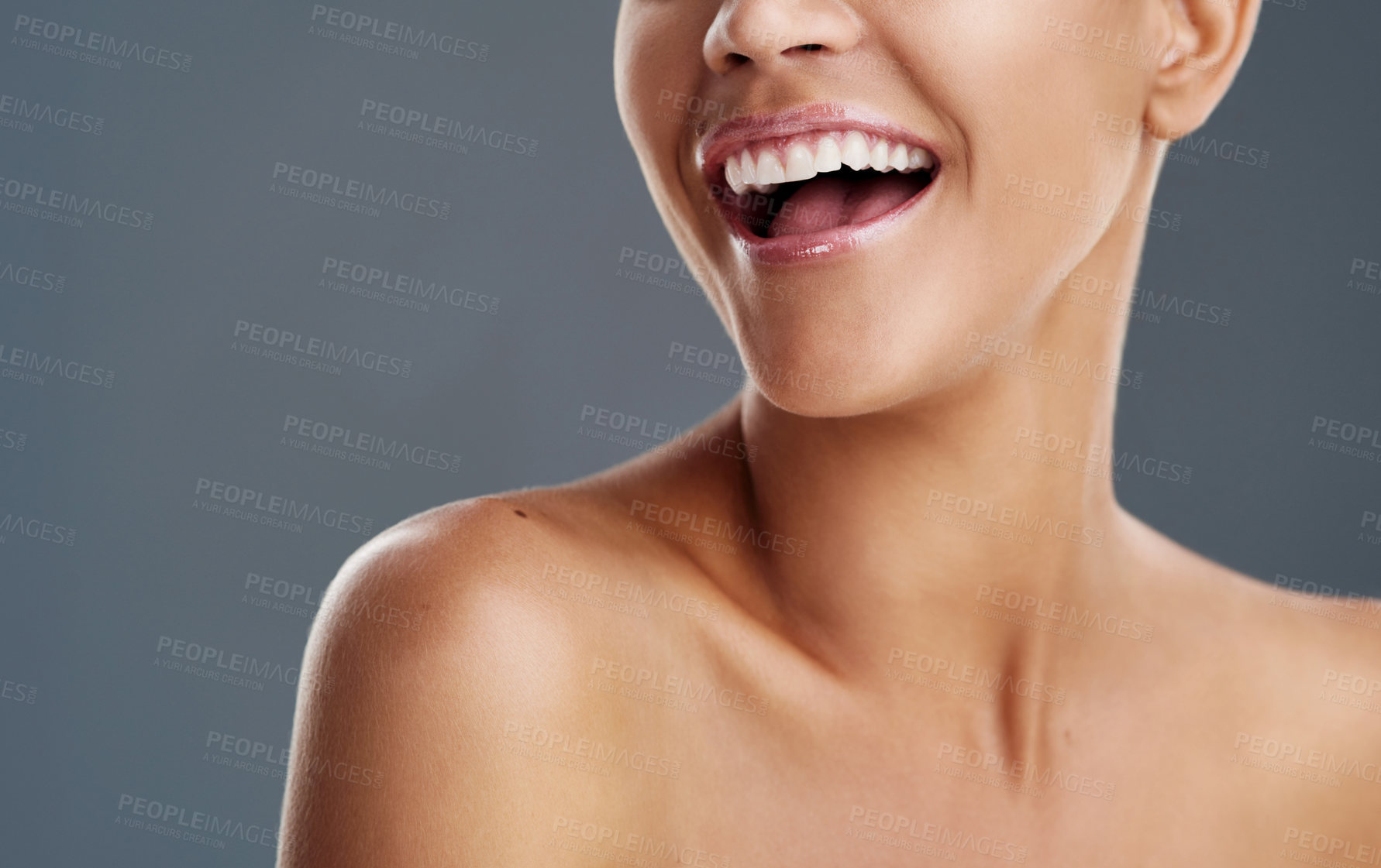 Buy stock photo Cropped shot of a beautiful young woman posing in the studio