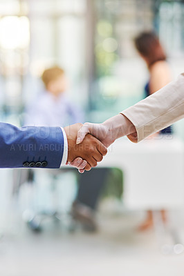 Buy stock photo Shot of two businesspeople shaking hands