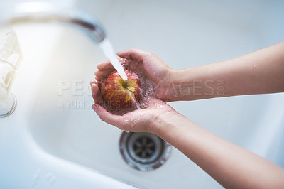 Buy stock photo Water, hands and person cleaning apple, hygiene in kitchen with  sustainability and disinfection, germs or bacteria. Health, wellness and nutrition with fruit, organic and top view of splash at home