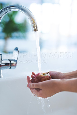 Buy stock photo Water, hands and person wash apple, hygiene in kitchen with  sustainability and disinfection, germs or bacteria. Health, wellness and nutrition with fruit, organic and food with splash at home