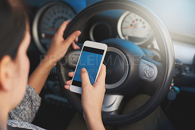 Buy stock photo Hand, phone screen and person driving in car for social media, typing or scroll on digital app online. Closeup, smartphone and display in transport, danger or travel on journey with steering wheel