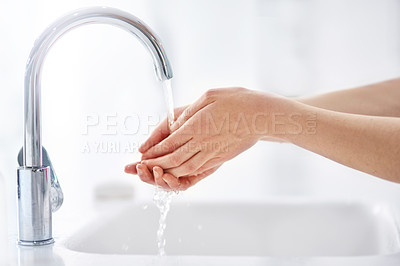 Buy stock photo Shot of hands being washed at a tap