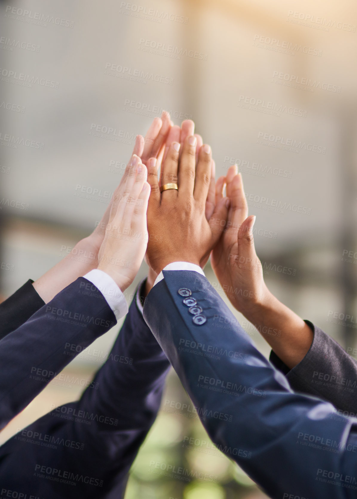 Buy stock photo Shot of a group of office workers giving each other a high five