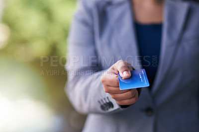 Buy stock photo Shot of a businesswoman holding out a credit card