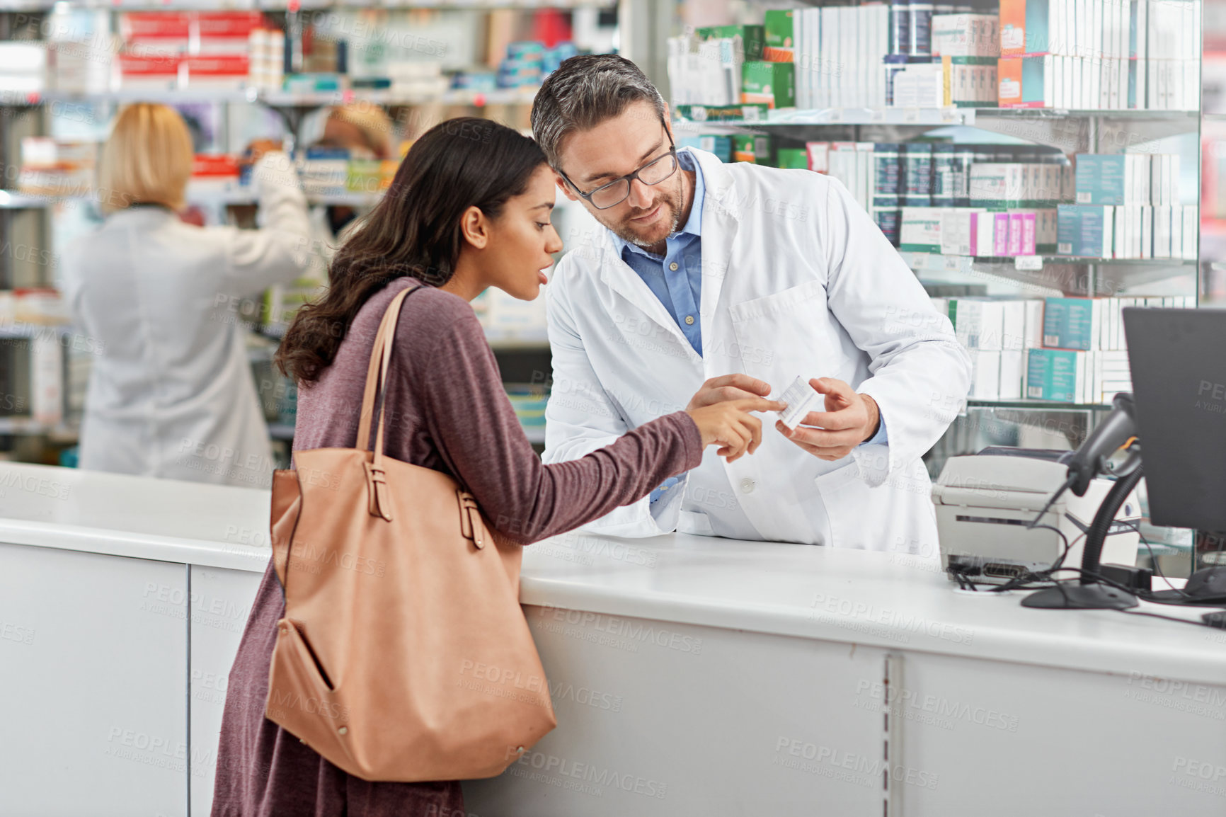 Buy stock photo Medicine, help and pharmacist advice with side effects at health store counter for customer service. Pharmaceutical advice and opinion of worker helping girl with medication information at pharmacy.