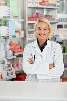 Buy stock photo Portrait of a pharmacist working in a drugstore. All products have been altered to be void of copyright infringements