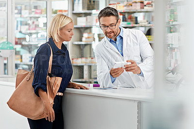 Buy stock photo Man, pharmacist and help customer, prescription and explain instructions for medicine, vitamins and wellness. Pharmacy, female client and medical professional speaking, pills and healthcare advice