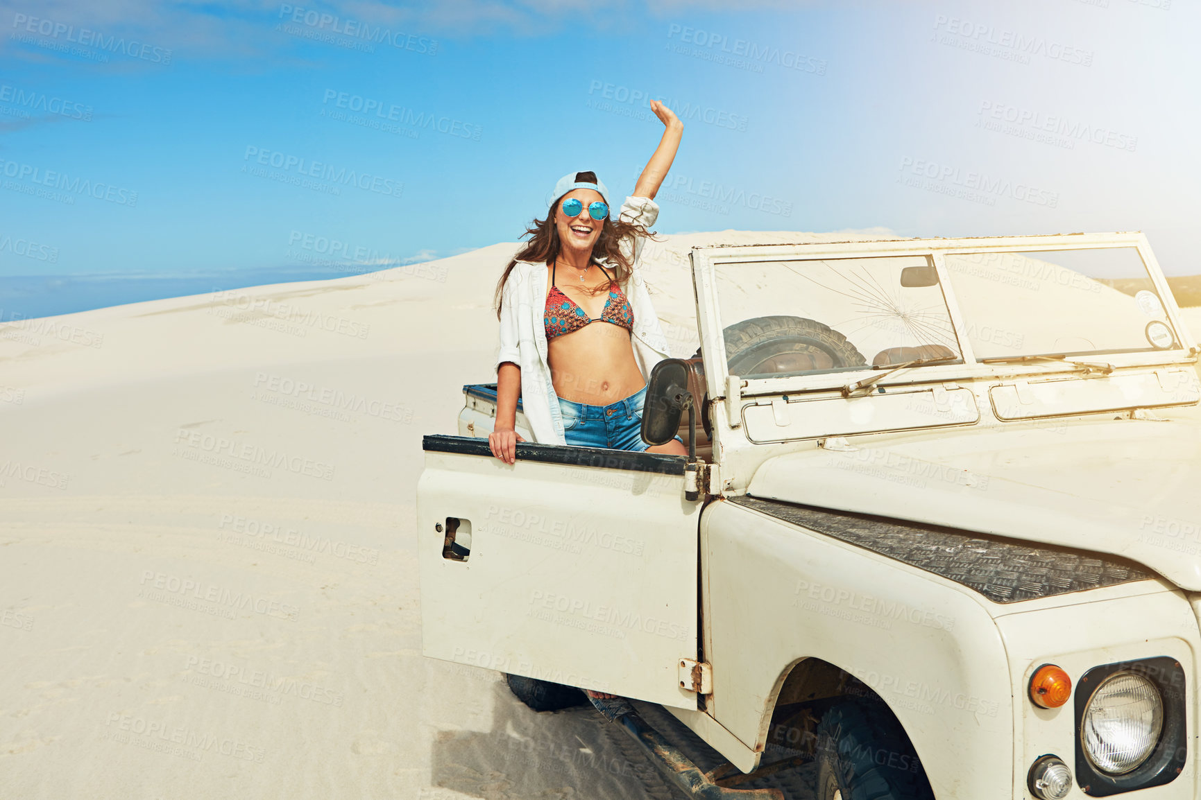 Buy stock photo Shot of a young woman going on a road trip in the desert