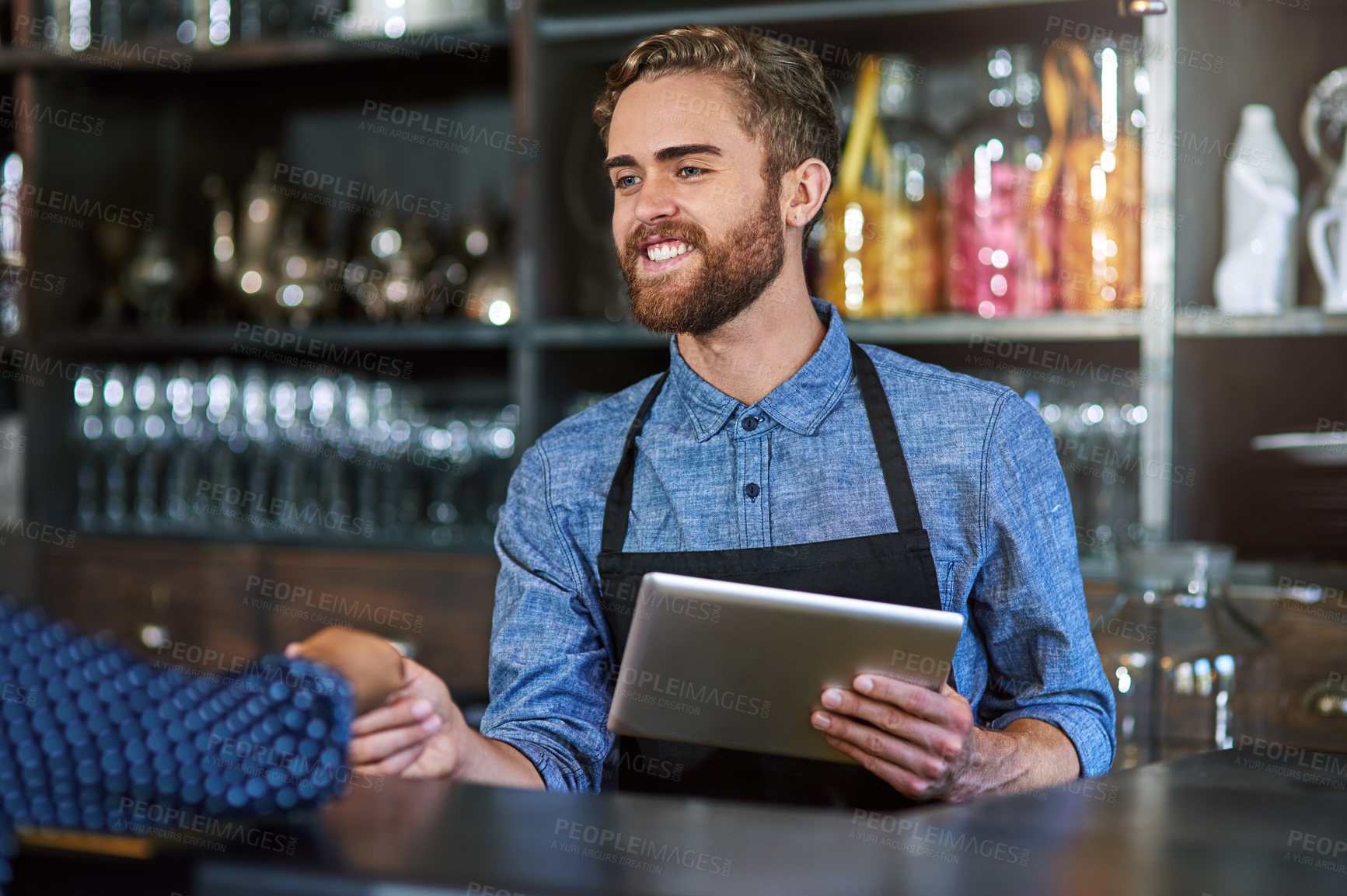 Buy stock photo Man, happy and tablet in cafe for customer service, digital payment and innovative POS software. Bartender, client and tech in pub for hospitality, transaction and smile for small business support