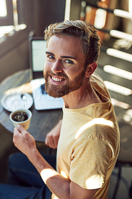 Buy stock photo Portrait of a young using a laptop in a cafe