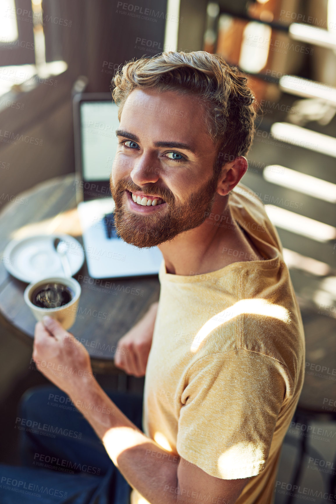 Buy stock photo Man, portrait and happy with coffee in cafe for cappuccino beverage, lunch break and morning drink. Person, customer and smile with espresso caffeine at restaurant table for remote work on laptop