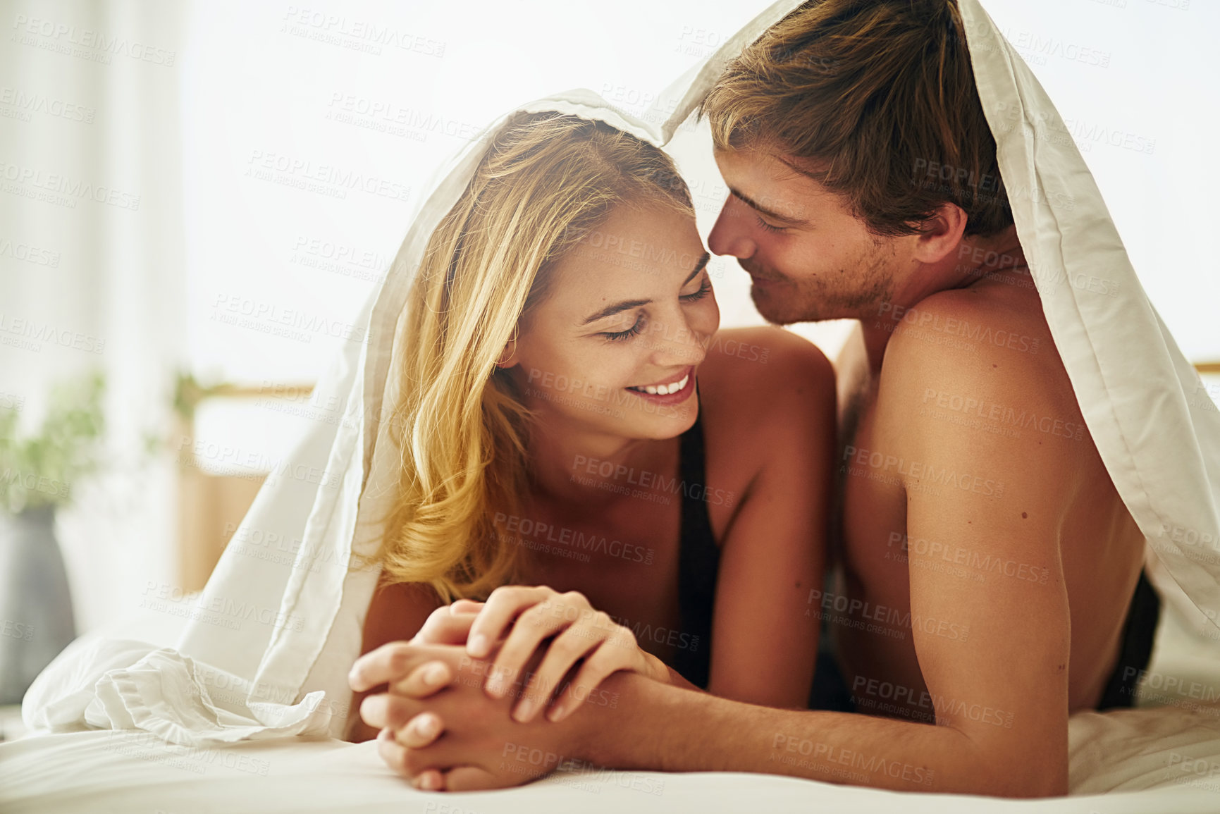 Buy stock photo Relax, morning and blanket with couple in bedroom for romance, valentines day and marriage. Honeymoon, getaway and care with man and woman at home or staycation for anniversary retreat and love