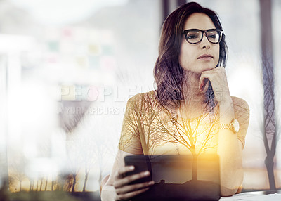 Buy stock photo Multiple exposure shot of a businesswoman using a digital tablet superimposed on a trees