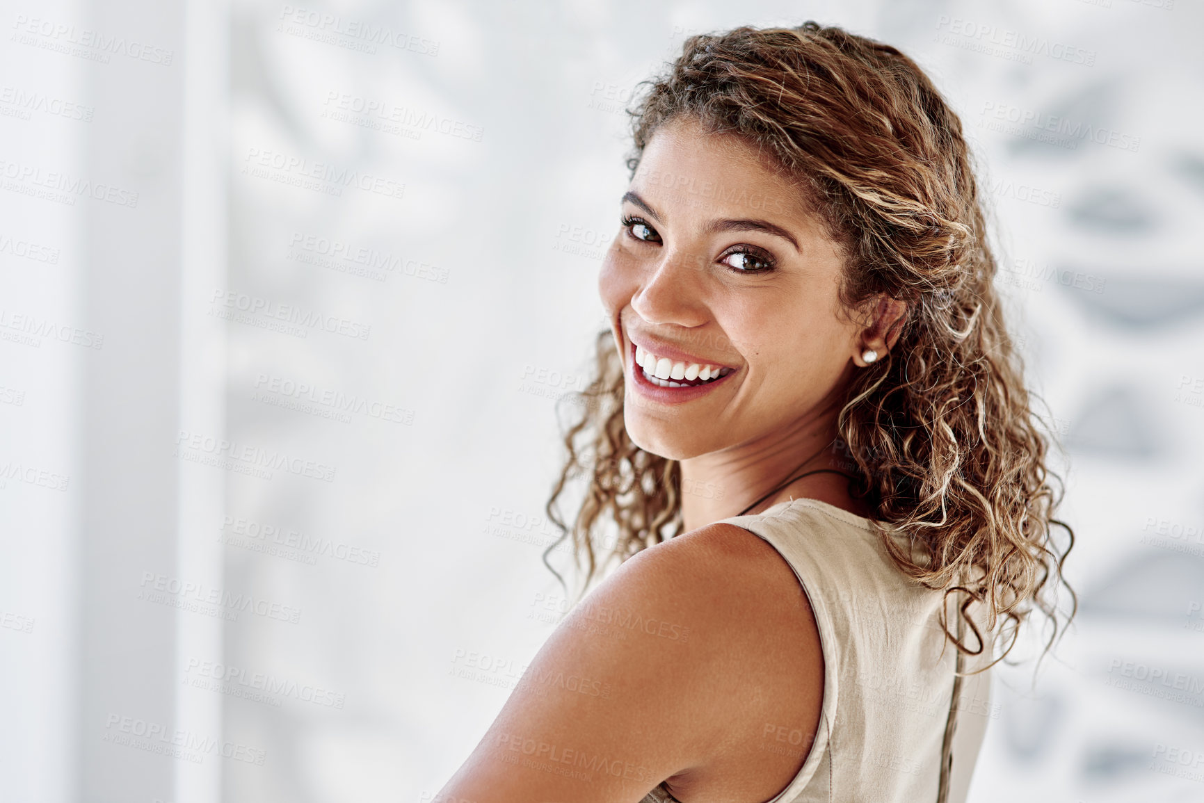 Buy stock photo Portrait of a smiling young businesswoman standing in an office