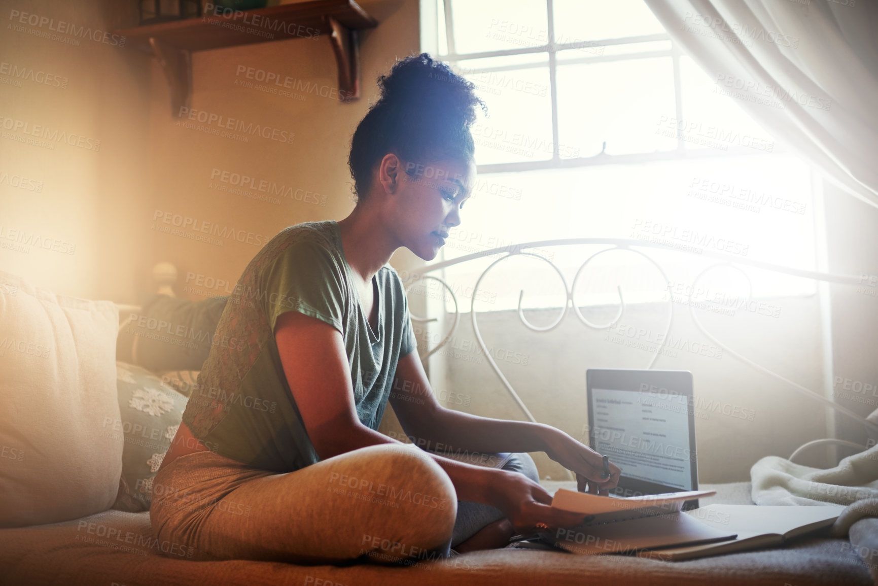 Buy stock photo Full length shot of a young female student studying at home