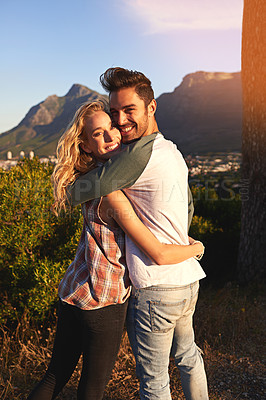 Buy stock photo Portrait of an affectionate young couple outdoors