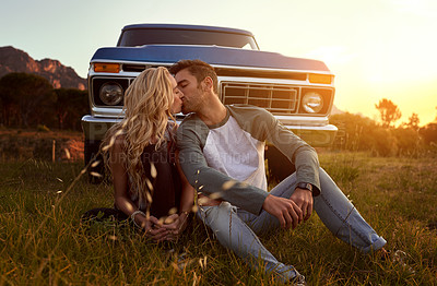 Buy stock photo Shot of an affectionate young couple on a roadtrip