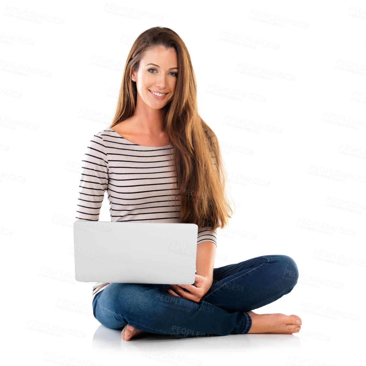 Buy stock photo Studio portrait of a young woman using a laptop against a white background