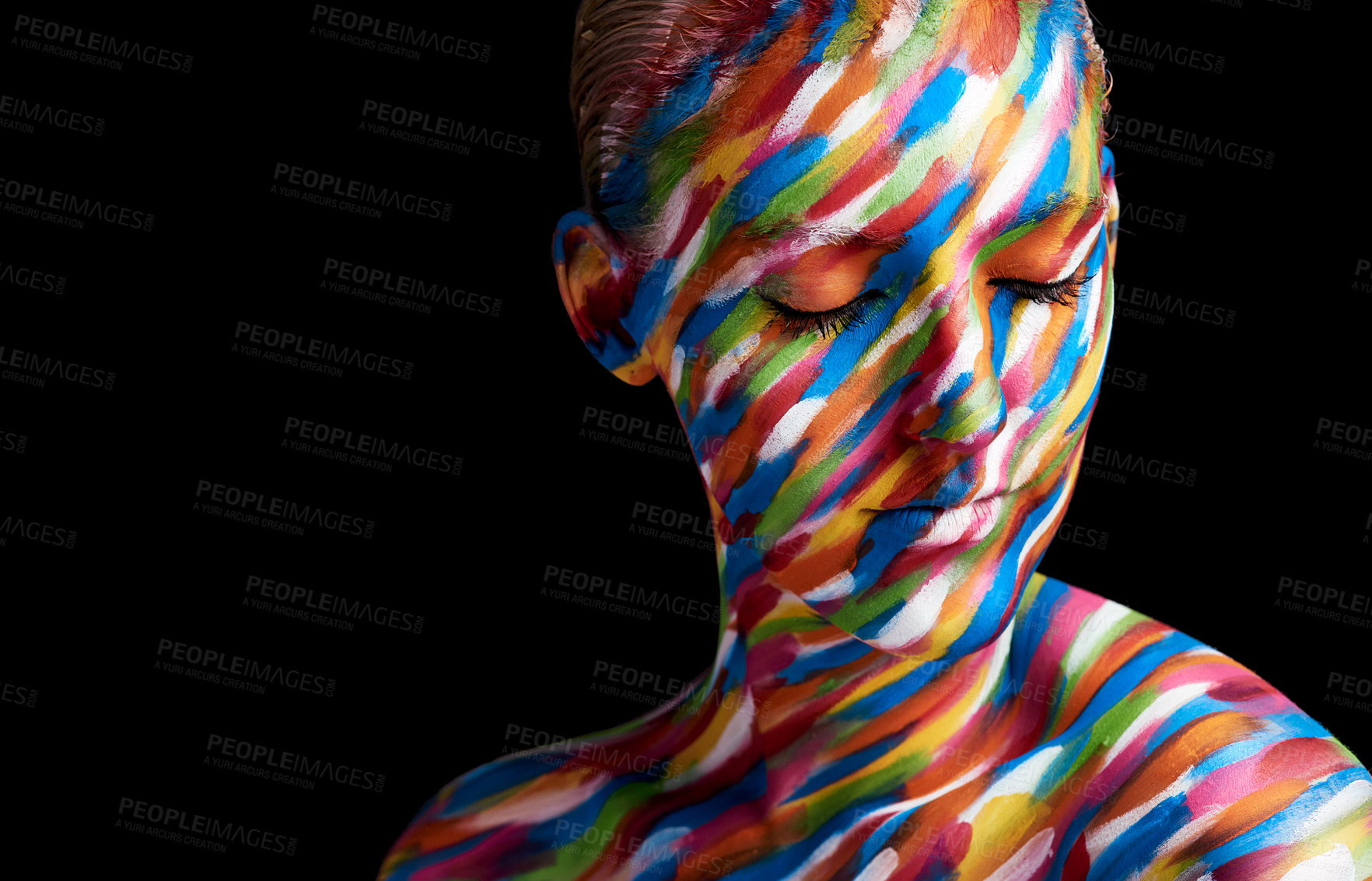 Buy stock photo Cropped shot of a young woman posing with paint on her face