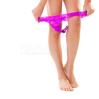 Buy stock photo Woman, legs and panties in studio, undress and sexy style for fashion on white background. Female person, mockup space and undressing or designer lingerie, care and remove underwear for aesthetic