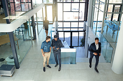 Buy stock photo Shot of a businesspeople at work in a large modern office