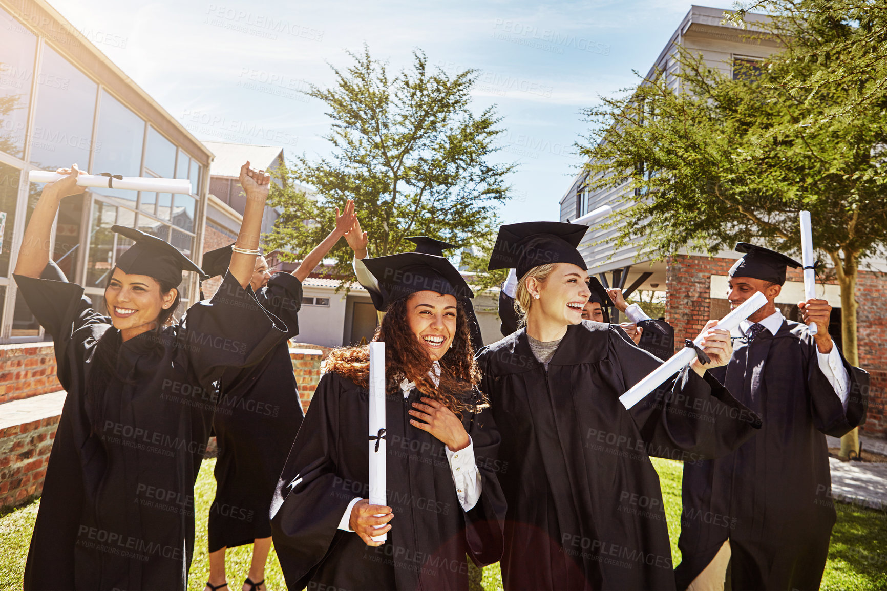 Buy stock photo Students, friends and graduation ceremony with diploma for education milestone or learning goals on campus. Group, people or excited outdoor for certificate celebration, achievement or college degree