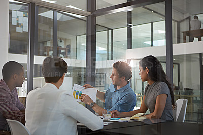 Buy stock photo Cropped shot of a group of colleagues meeting in the office