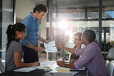 Buy stock photo Cropped shot of a group of colleagues meeting in the office