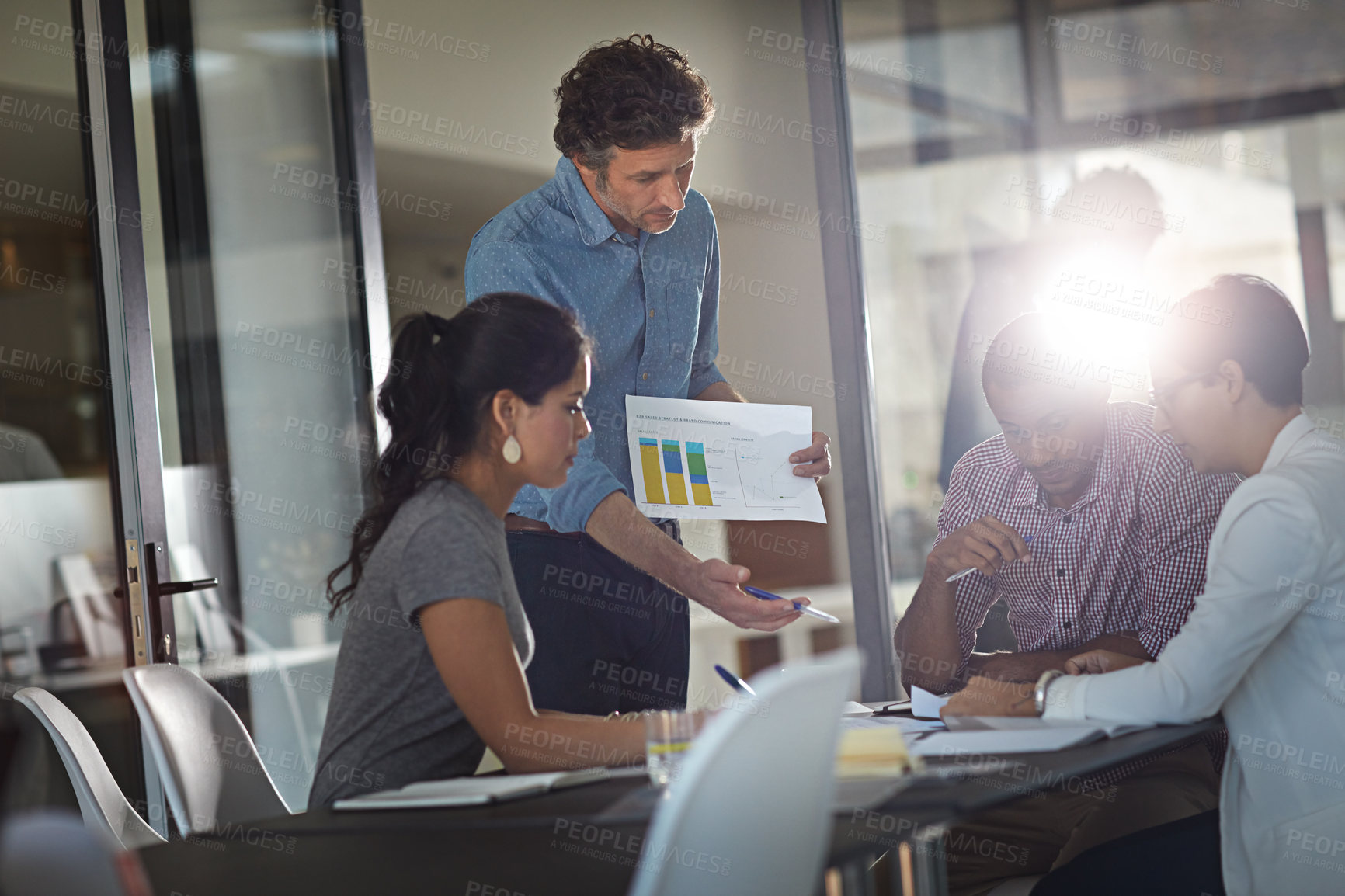 Buy stock photo Cropped shot of a group of colleagues meeting in the office