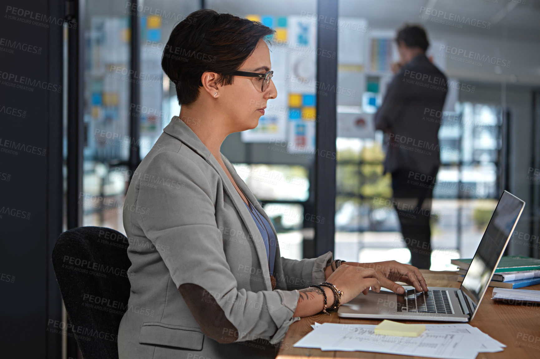 Buy stock photo Cropped shot of a businesswoman working in her office