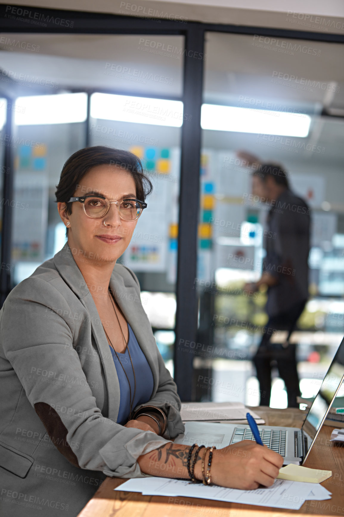 Buy stock photo Cropped portrait of a businesswoman working in her office