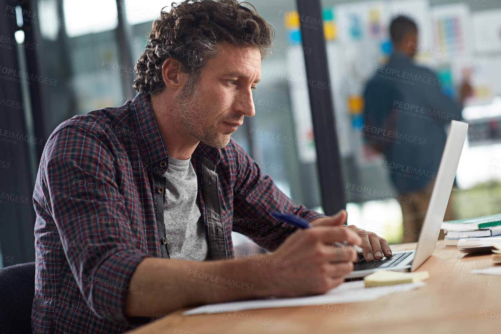 Buy stock photo Cropped shot of a businessman working in his office