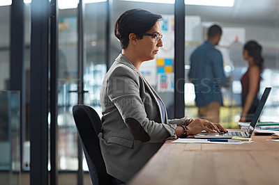 Buy stock photo Cropped shot of a businesswoman working in her office