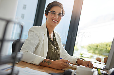 Buy stock photo Portrait of a businesswoman working on a computer in an office