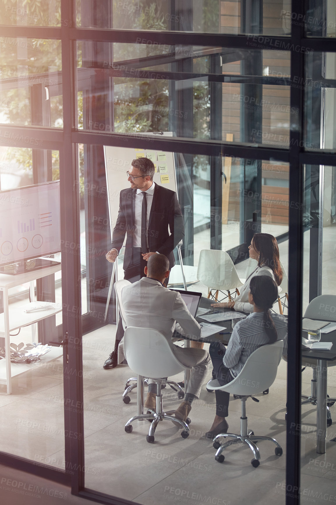 Buy stock photo Shot of a businessman giving a presentation in the boardroom