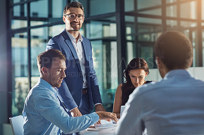 Buy stock photo Business people, office and meeting for strategy, planning and success with teamwork, vision and leader. Businessman, leadership and group at desk with woman, black man and documents for innovation