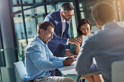 Buy stock photo Shot of businesspeople having an office meeting
