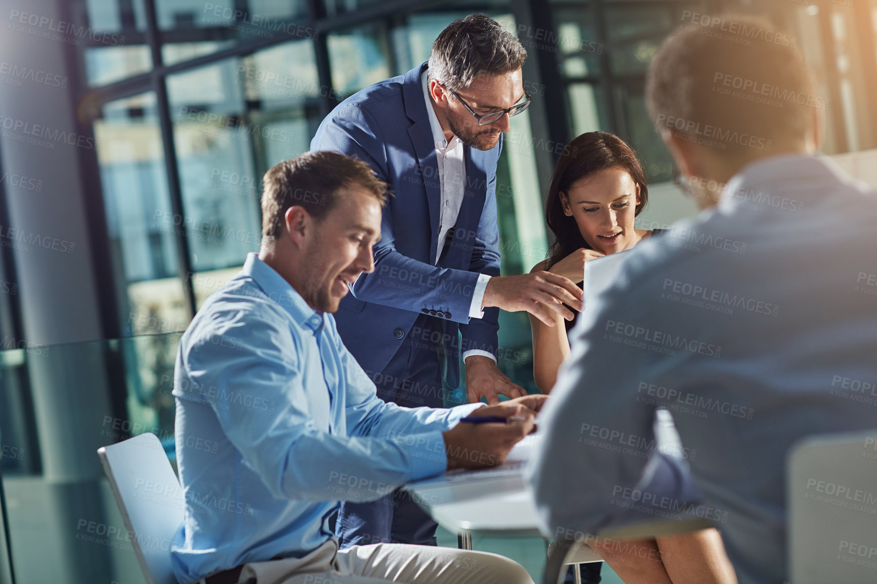 Buy stock photo Shot of businesspeople having an office meeting
