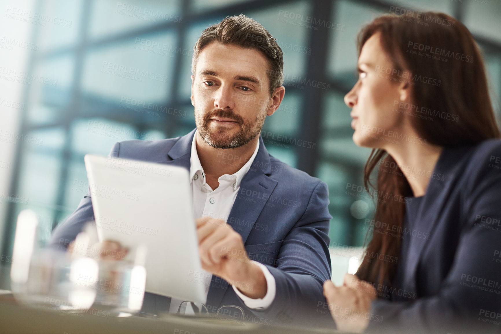 Buy stock photo Meeting, tablet and planning with business people in the office for research on a company team project. Teamwork, technology or brainstorming with a corporate man and woman people talking at work