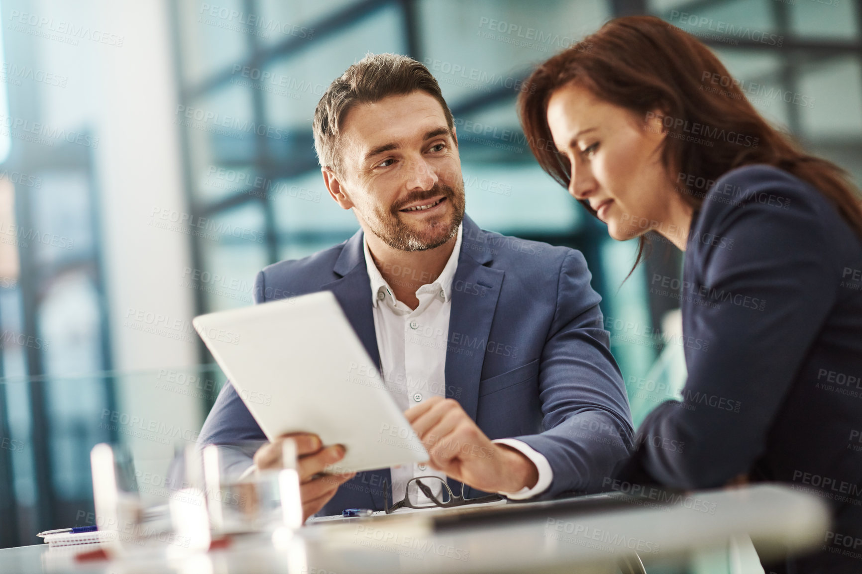 Buy stock photo Collaboration, tablet and meeting with a business team in the office for research on a company project. Teamwork, technology and brainstorming with corporate people planning a strategy at work