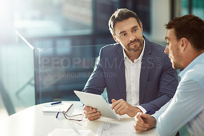 Buy stock photo Cropped shot of two businessmen meeting in the office