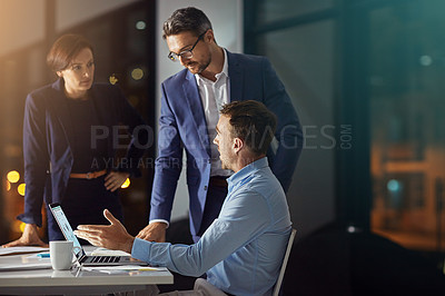 Buy stock photo Business people, night office and planning on laptop with teamwork and collaboration working in dark. Digital marketing team of men and women together for innovation, ideas and talking about review