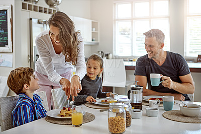Buy stock photo Shot of a family having breakfast together