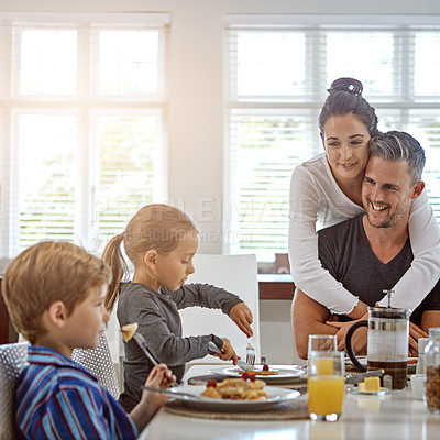 Buy stock photo Shot of a family having breakfast together