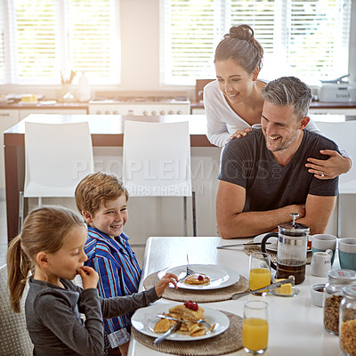 Buy stock photo Shot of a family having breakfast together