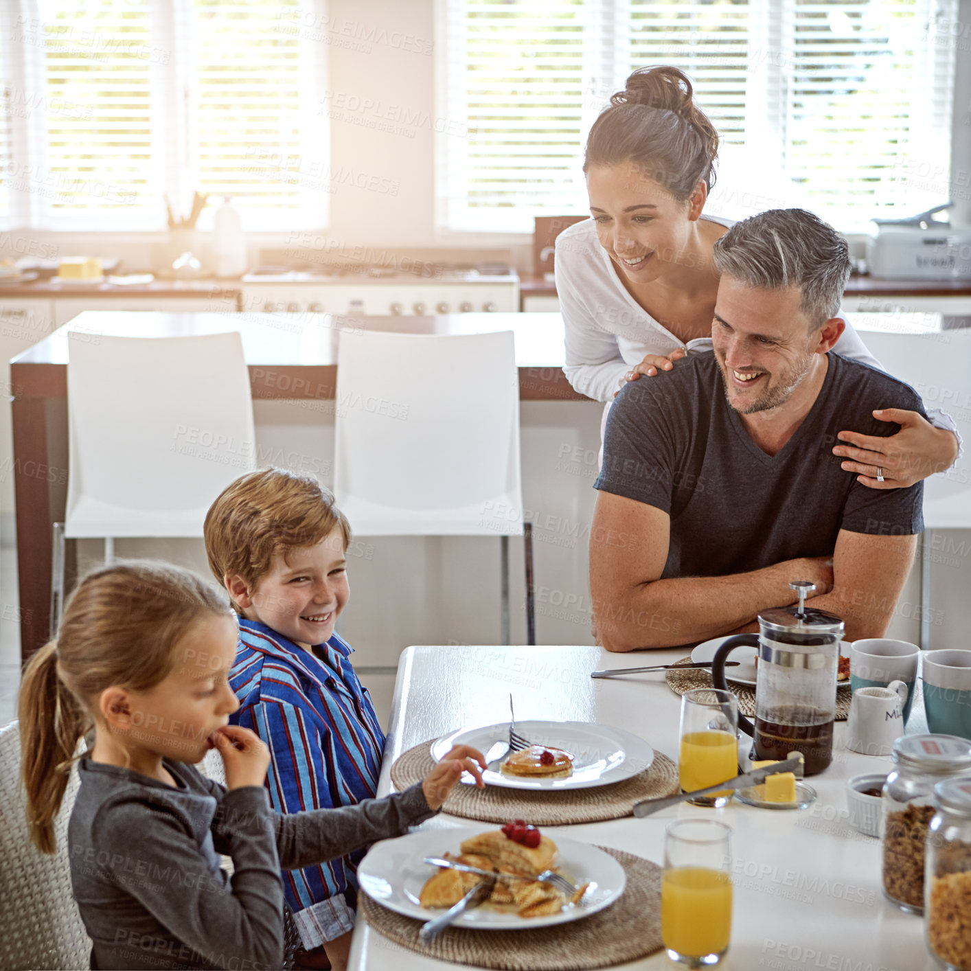 Buy stock photo Shot of a family having breakfast together