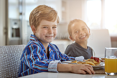 Buy stock photo Shot of a sister and brother having breakfast