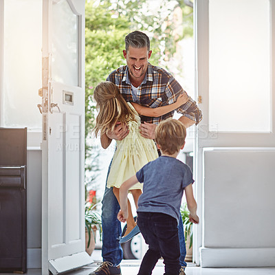 Buy stock photo Shot of two children running towards their father as he enters the house